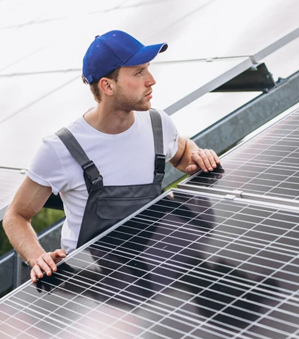 Solar technician inspecting rooftop solar panels to ensure proper alignment and performance after home upgrades