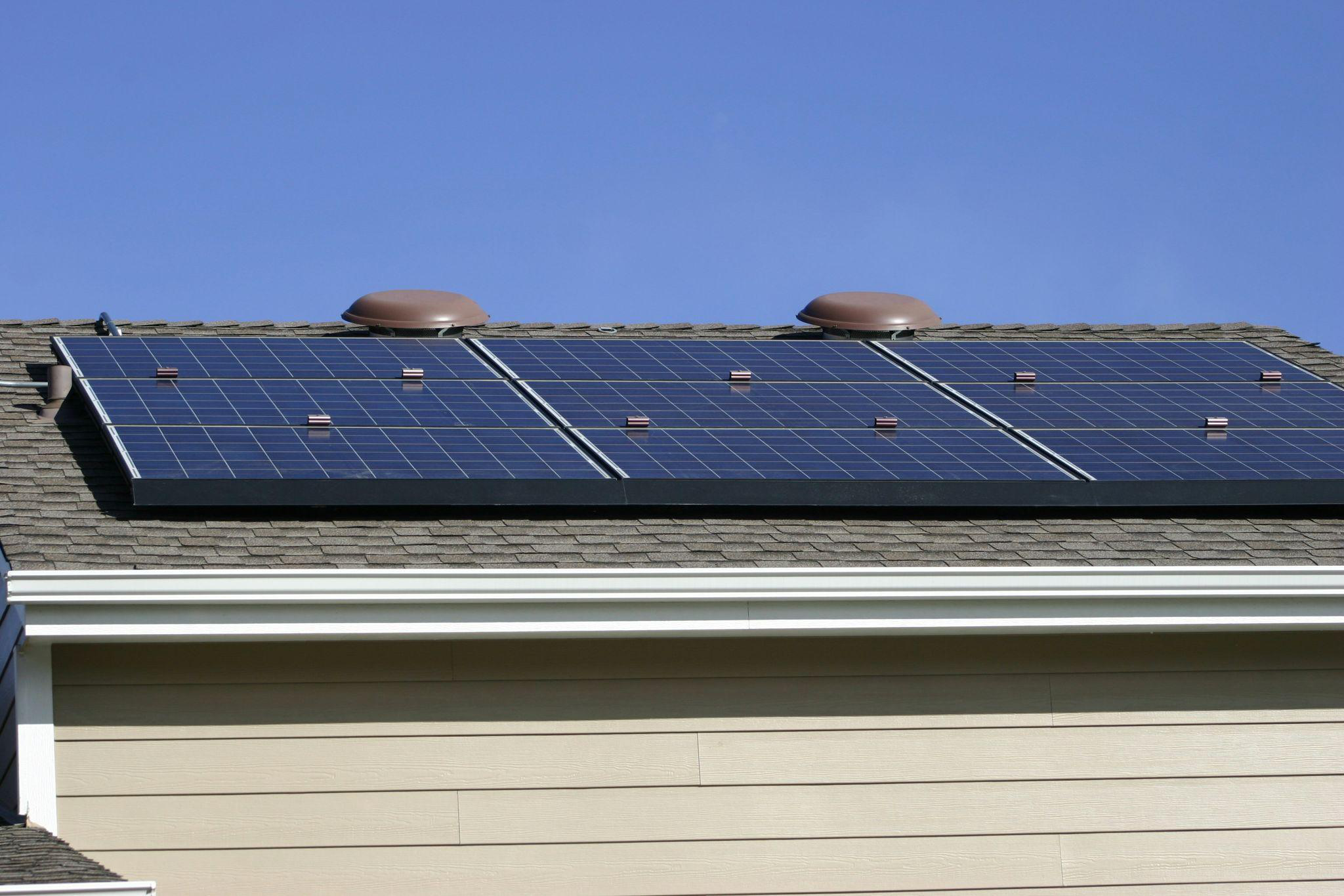 Roof-mounted solar panel array installed on a residential house