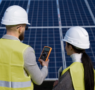Technicians using an electrical meter to inspect a residential solar system