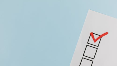 Checklist sheet with empty boxes ticked, representing items to verify before hiring a solar contractor.