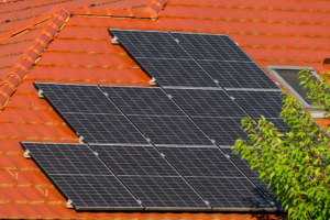 freshly reinstalled solar panels on a new roof with clean mounting hardware