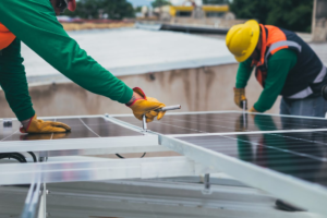licensed solar technicians reinstalling solar panels on a residential roof in the Bay Area