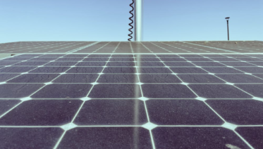 dirty solar panels covered in dust and bird droppings on a residential roof