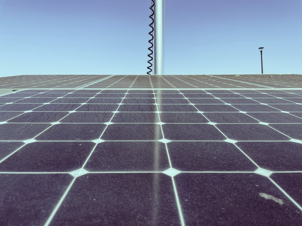 dirty solar panels covered in dust and bird droppings on a residential roof