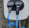 EV charger securely mounted on an exterior residential wall for convenient home charging.