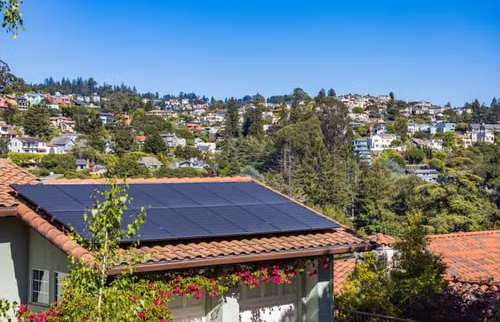 Modern home with rooftop solar panels.