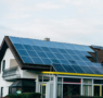 A large house with solar panels on the roof.