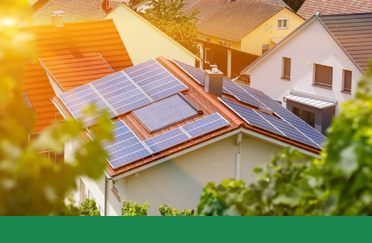 A large house with solar panels one the roof.