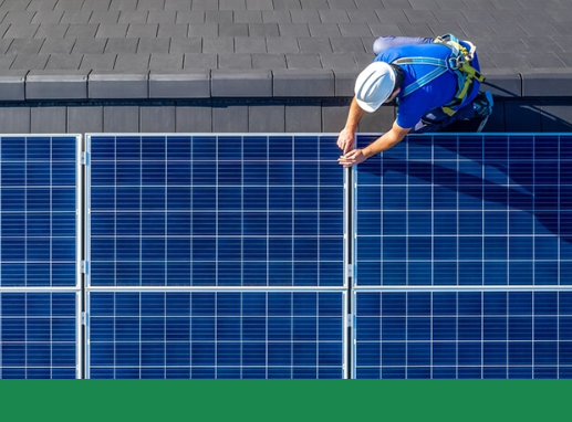 A person working on solar panel installations.