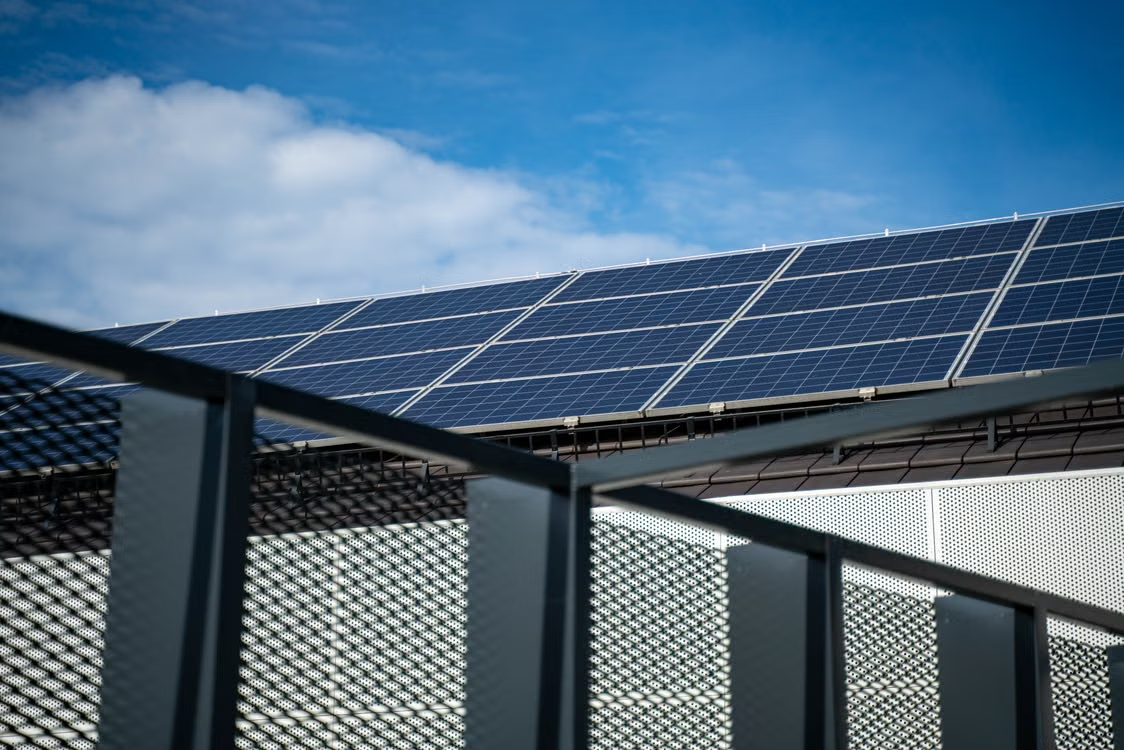 A huge number of solar panels lined up together.