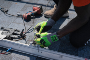 Technician fixing a residential solar electrical system