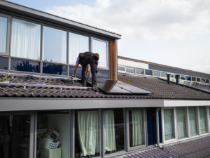 Technician recommissioning solar system after roof replacement